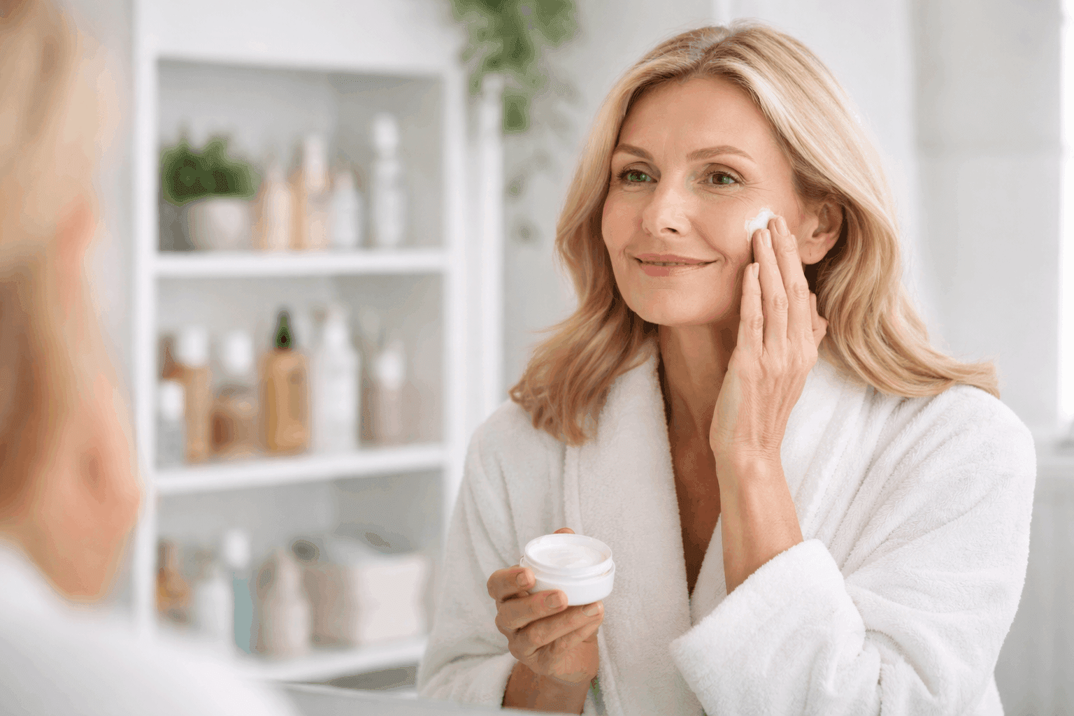 **Basic prompt:** “Middle-aged woman applying face cream in a bathroom, looking in the mirror, shelf with cosmetics in background, realistic.”